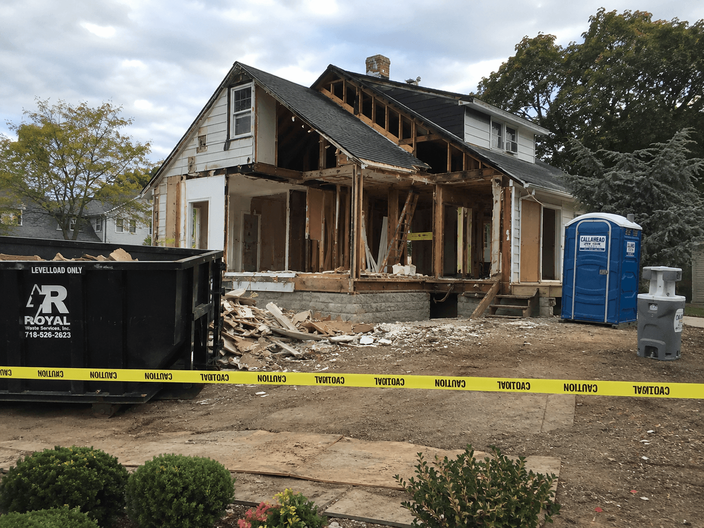 Single unit and handwash station beside a house under renovation